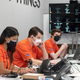 Aung (left) and other members of the Ingenuity team awaited data from Mars early this morning.